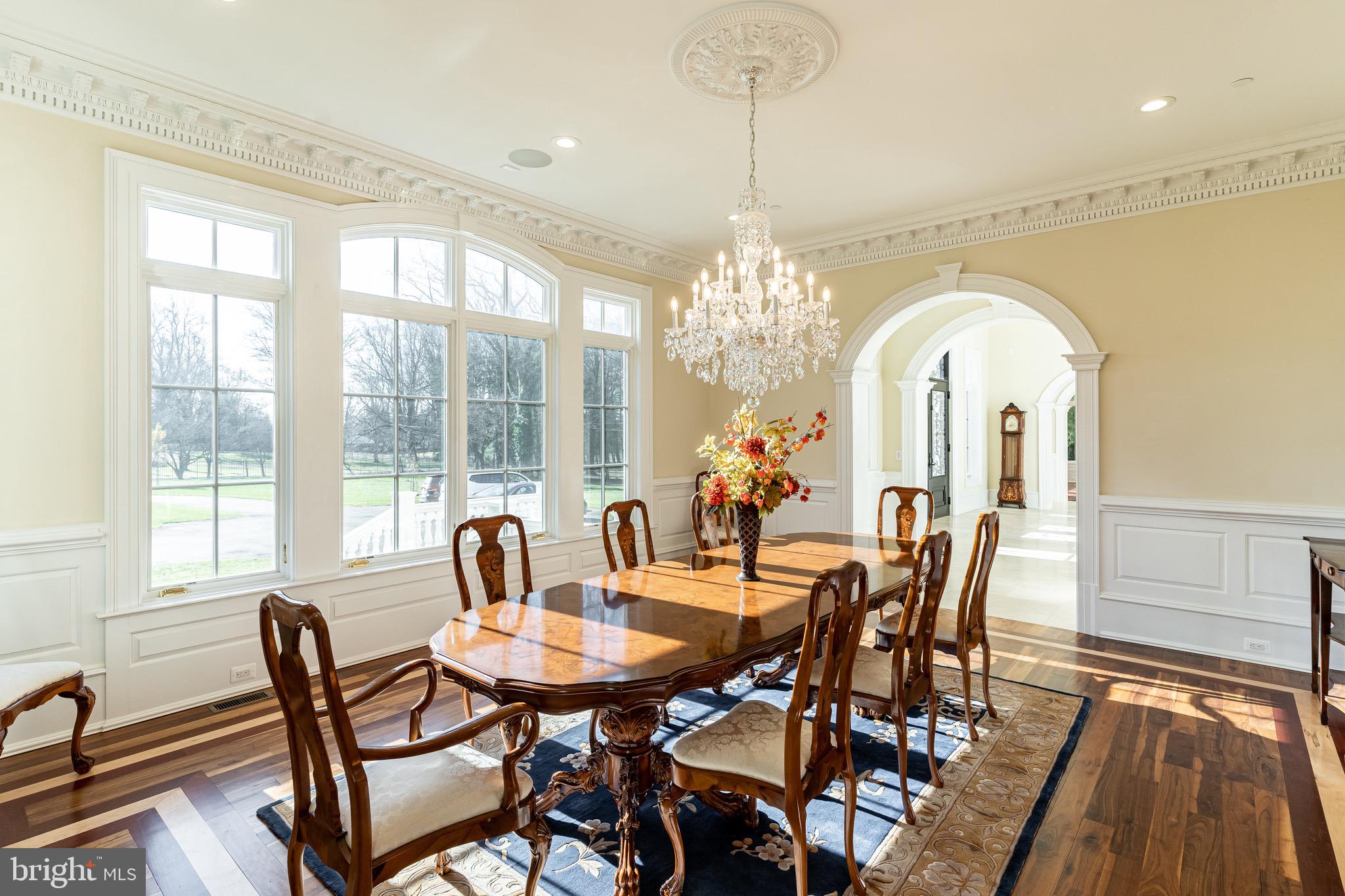 10110 Chapel Road Potomac, MD 20854 - Photo 6 of 28 a view of a dining room with furniture a chandelier and wooden floor