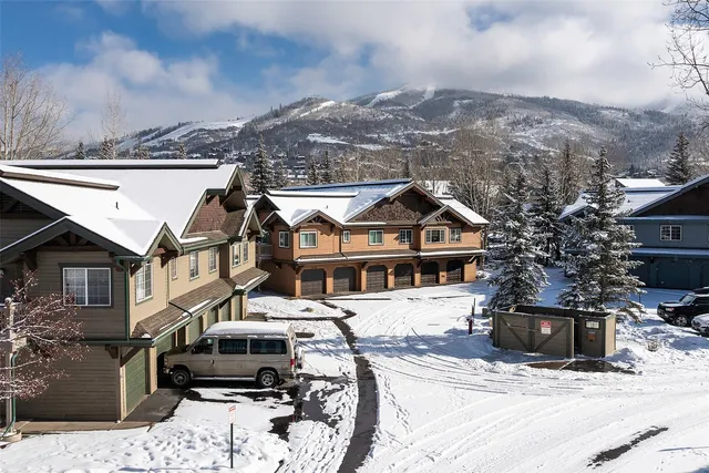 a view of a city street with a house