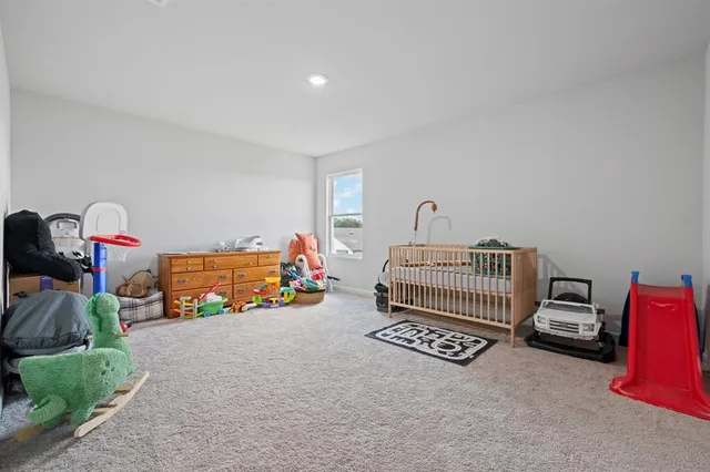 a view of a livingroom with toys and a couch