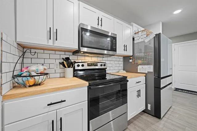 a kitchen with a stove and a microwave