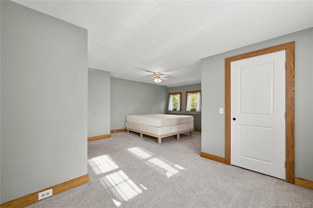 4 Ironworks Hill Road Brookfield, CT 06804 - Photo 22 of 34 Primary Bedroom - lots of space, wall to wall carpet and walk in closet