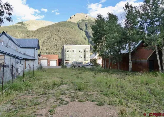 a view of a street with a building in the background