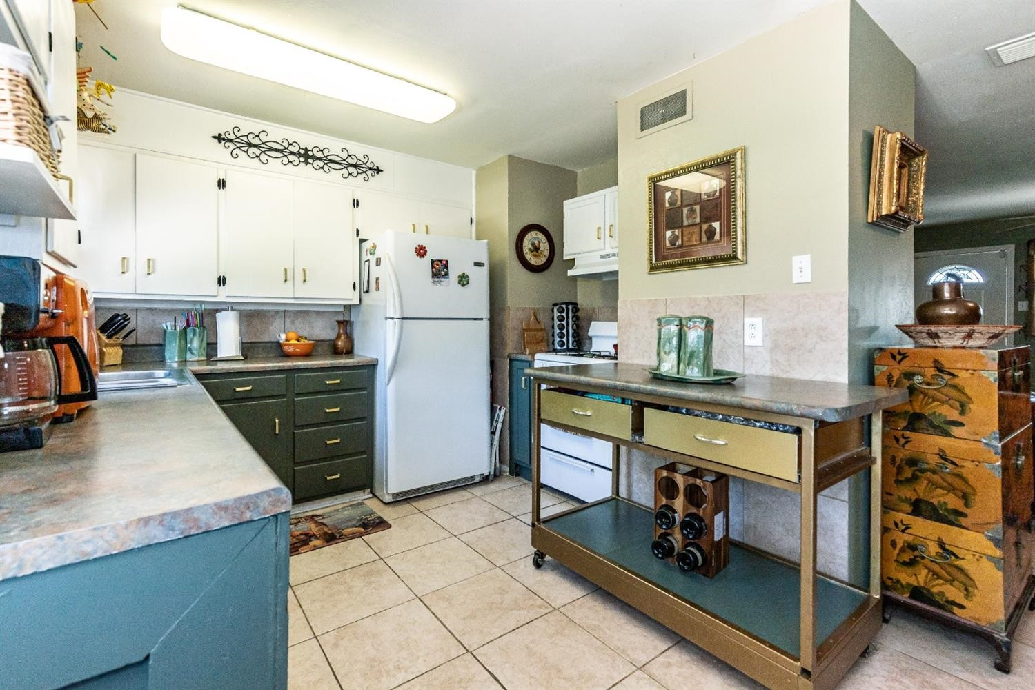 2820 62nd Street Lubbock, TX 79413 - Photo 22 of 43 a kitchen with stainless steel appliances kitchen island granite countertop a stove and cabinets