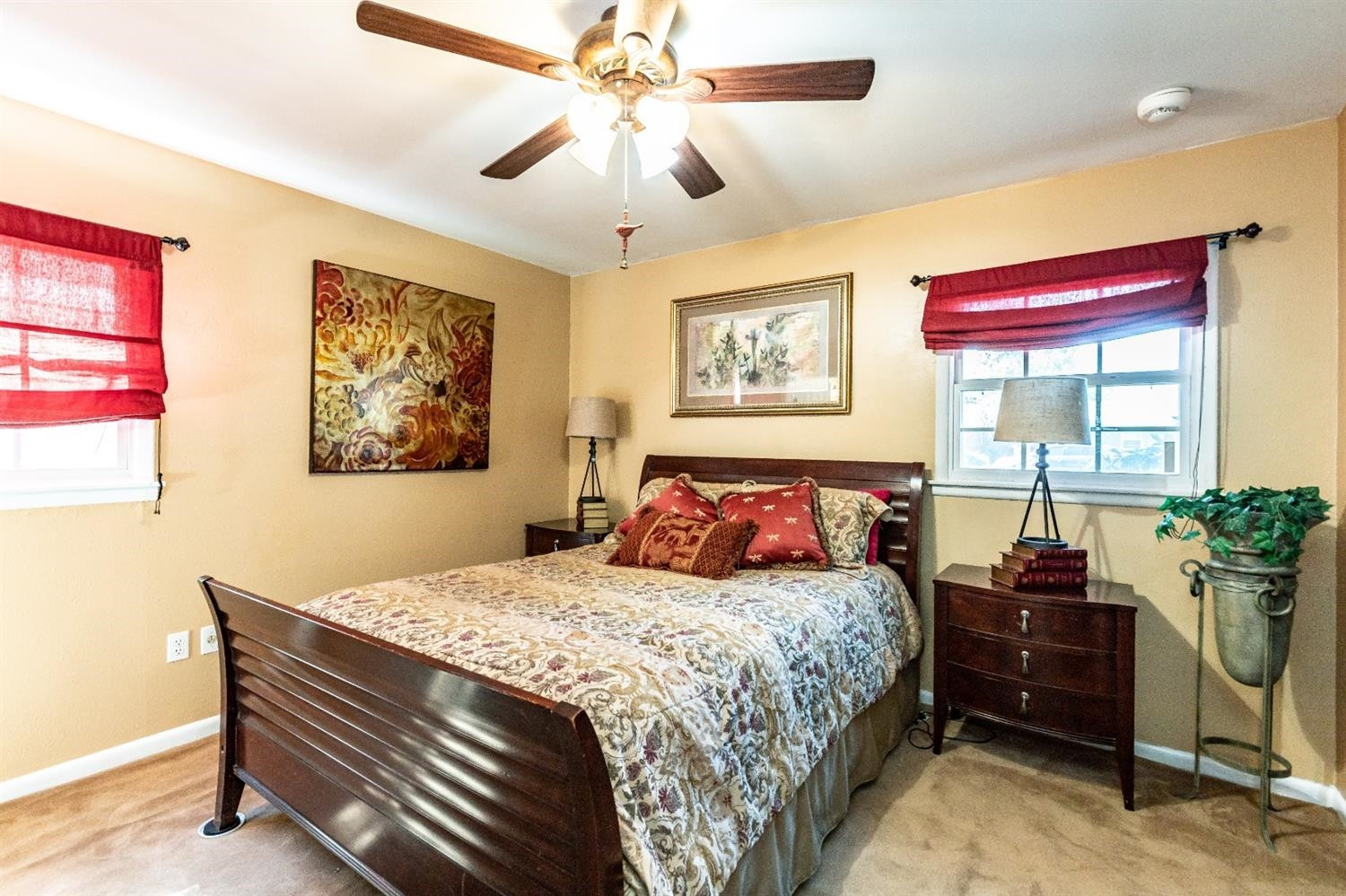 2820 62nd Street Lubbock, TX 79413 - Photo 24 of 43 a bedroom with a bed and a chandelier