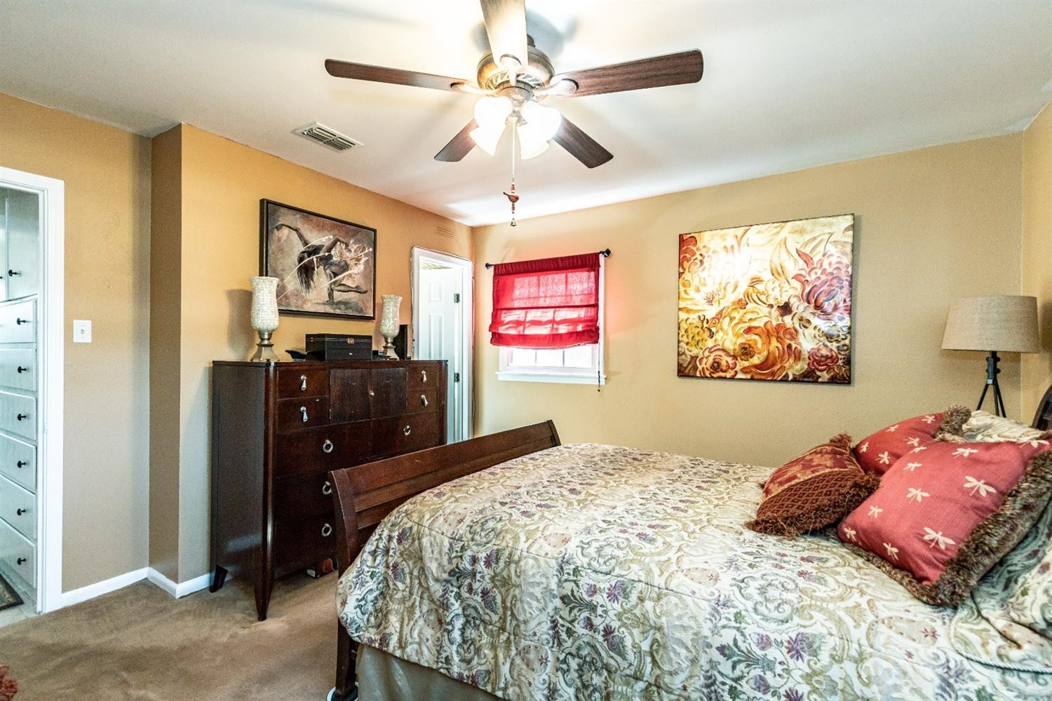 2820 62nd Street Lubbock, TX 79413 - Photo 25 of 43 a bedroom with a bed and a painting on the wall