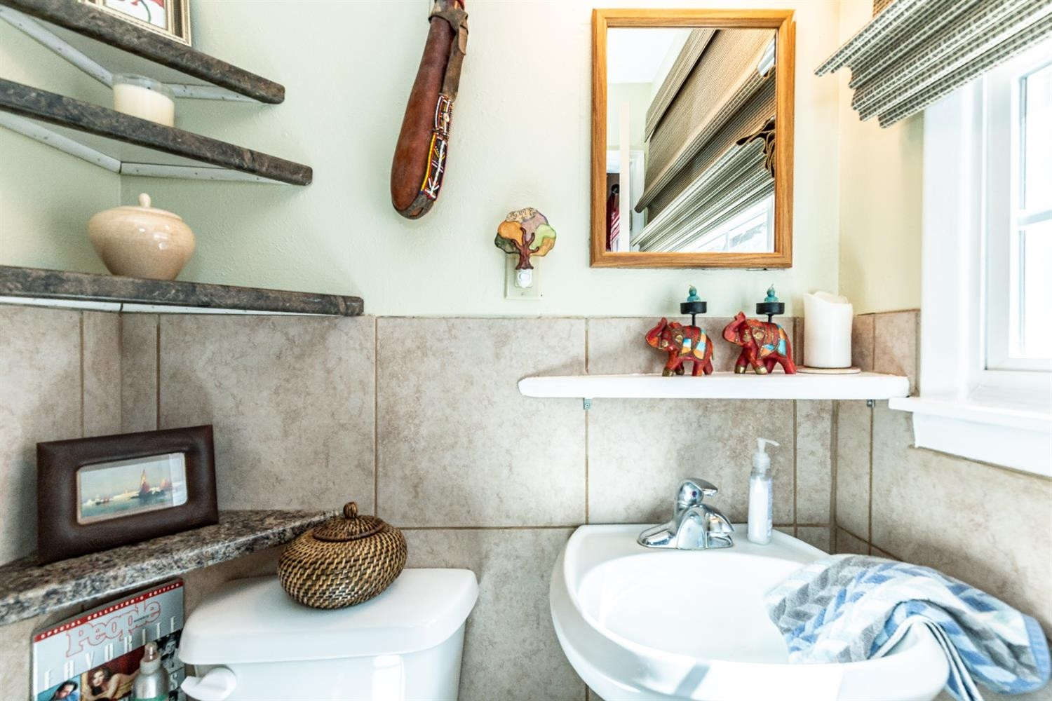 2820 62nd Street Lubbock, TX 79413 - Photo 27 of 43 a bathroom with a sink and a mirror