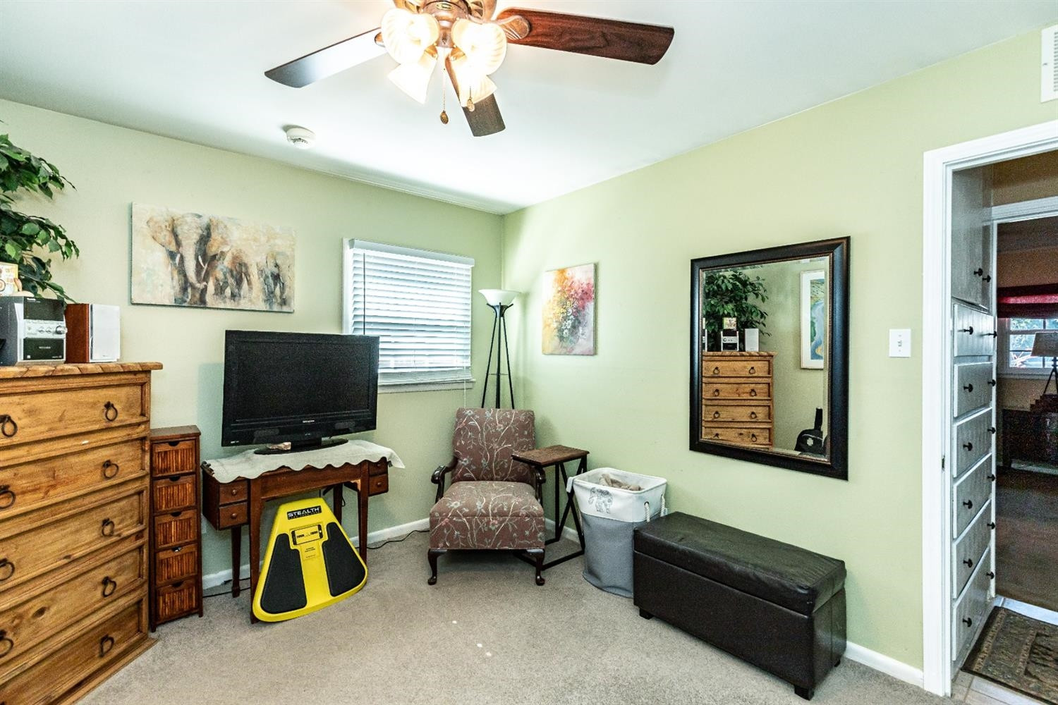 2820 62nd Street Lubbock, TX 79413 - Photo 30 of 43 a living room with furniture and a flat screen tv
