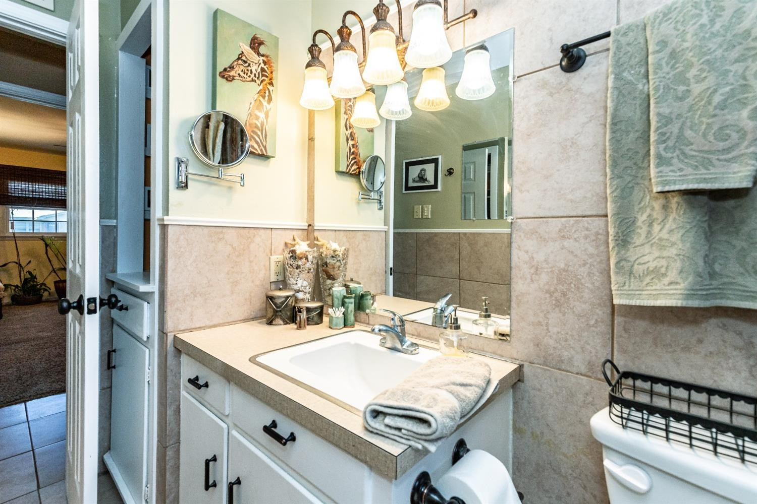 2820 62nd Street Lubbock, TX 79413 - Photo 32 of 43 a bathroom with a sink mirror and a shower
