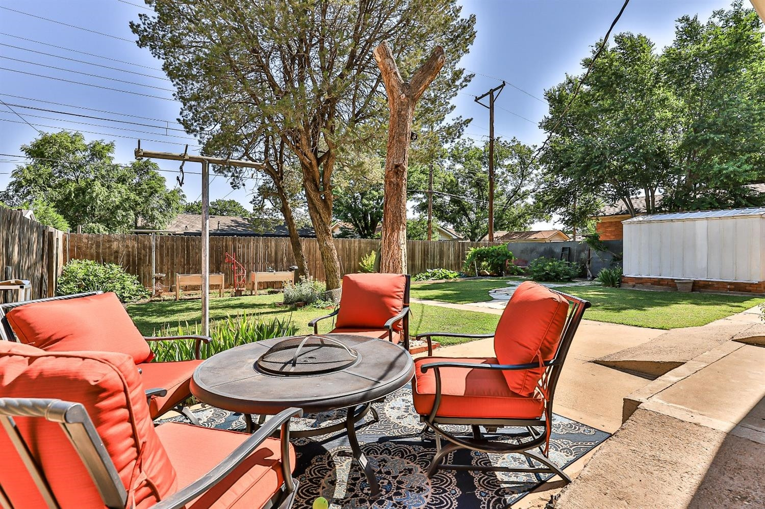 2820 62nd Street Lubbock, TX 79413 - Photo 39 of 43 a backyard of a house with outdoor seating