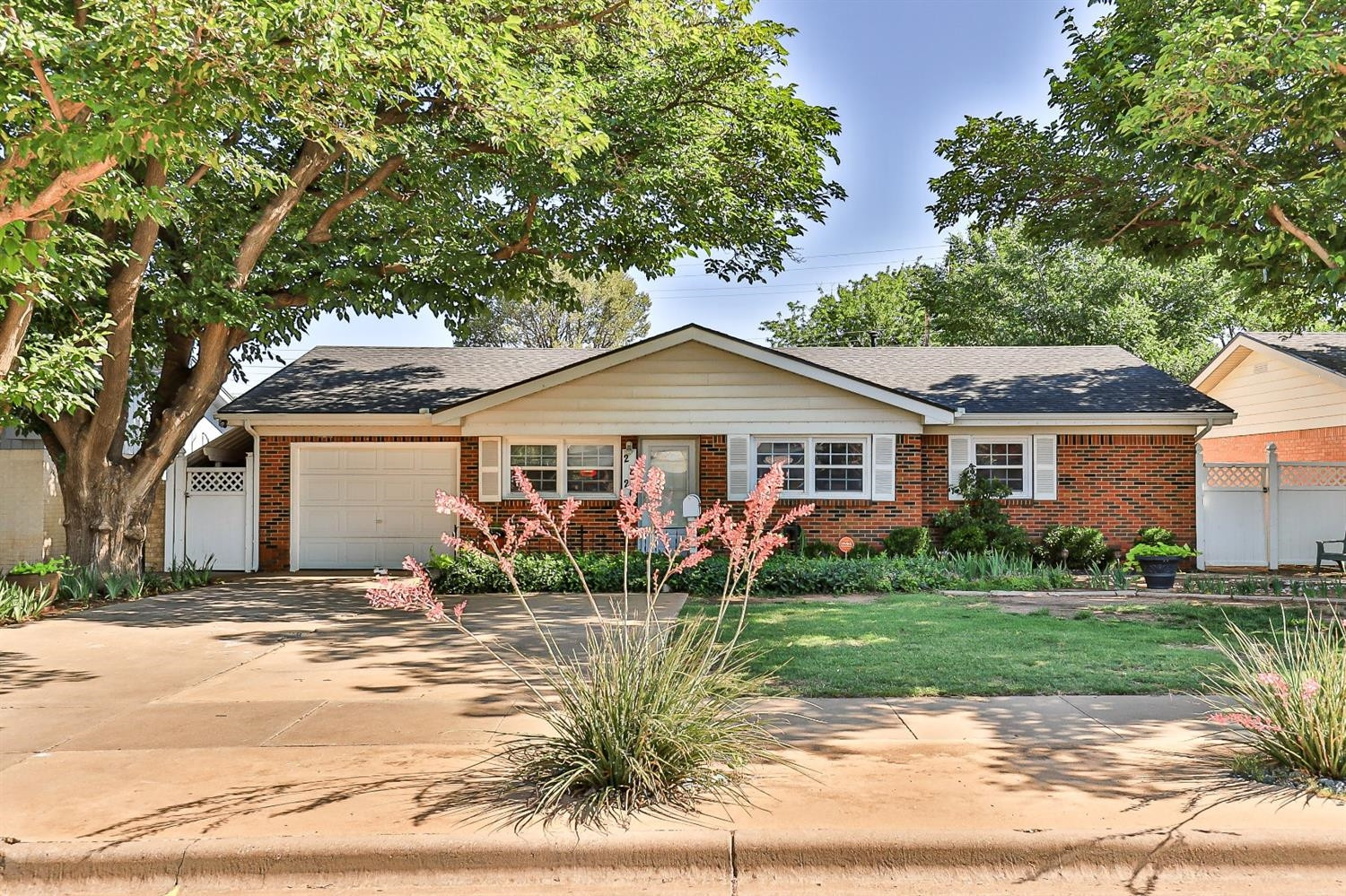 2820 62nd Street Lubbock, TX 79413 - Photo 5 of 43 a front view of a house with garden
