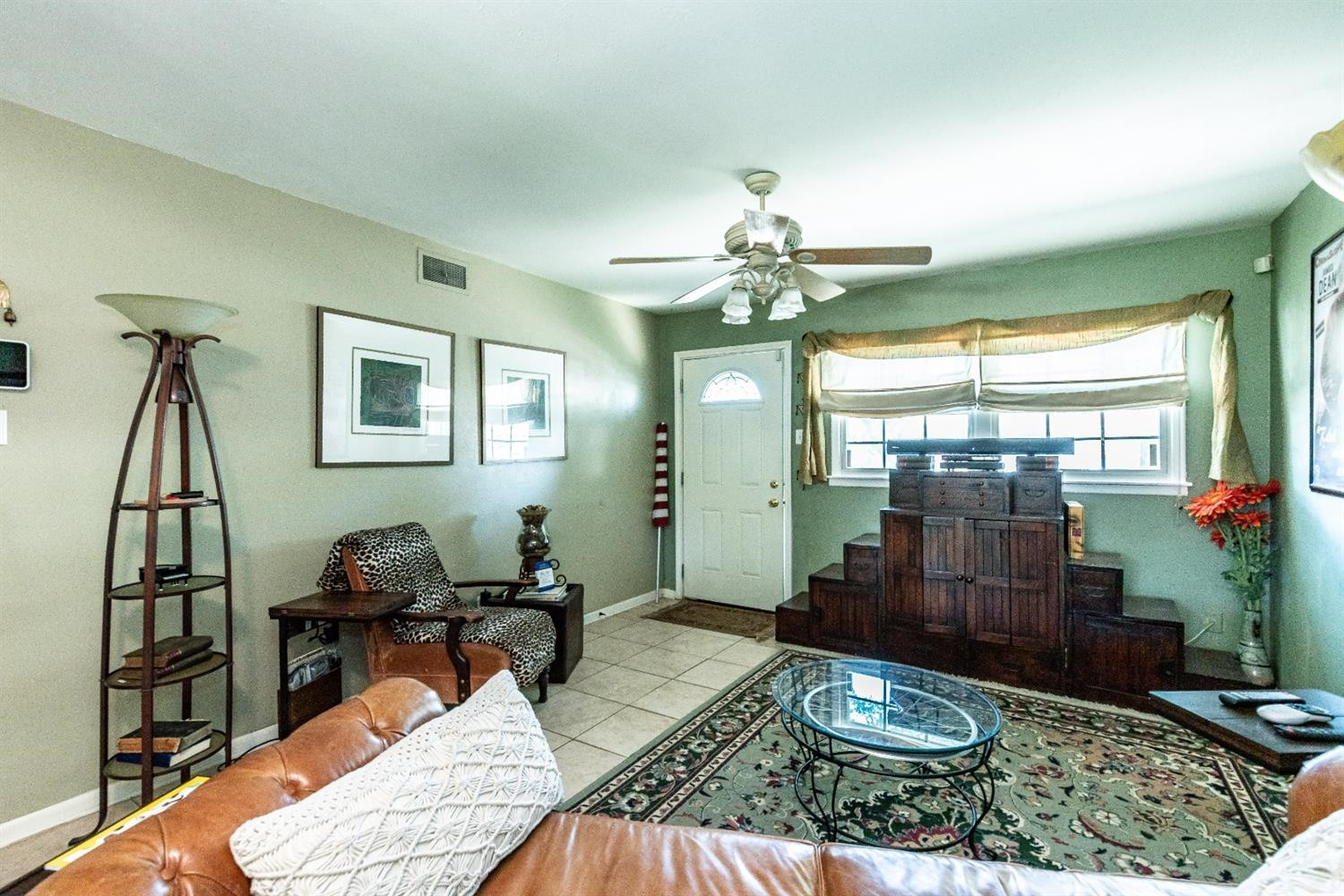 2820 62nd Street Lubbock, TX 79413 - Photo 10 of 43 a living room with furniture and a chandelier
