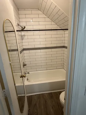 a bathroom with a shower and a sink