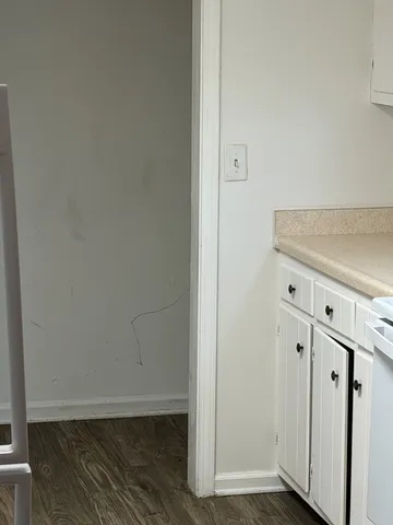 an empty room with wooden floor