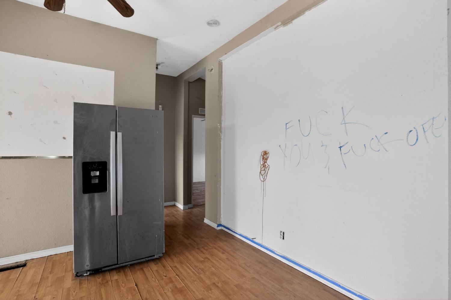 7212 Fox Corning, CA 96021 - Photo 21 of 36 a view of a kitchen with wooden floor and a refrigerator