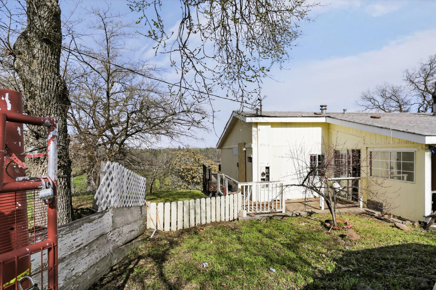 7212 Fox Corning, CA 96021 - Photo 3 of 36 a view of a porch with a bench and wooden fence