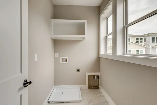 a bathroom with a window and a shower