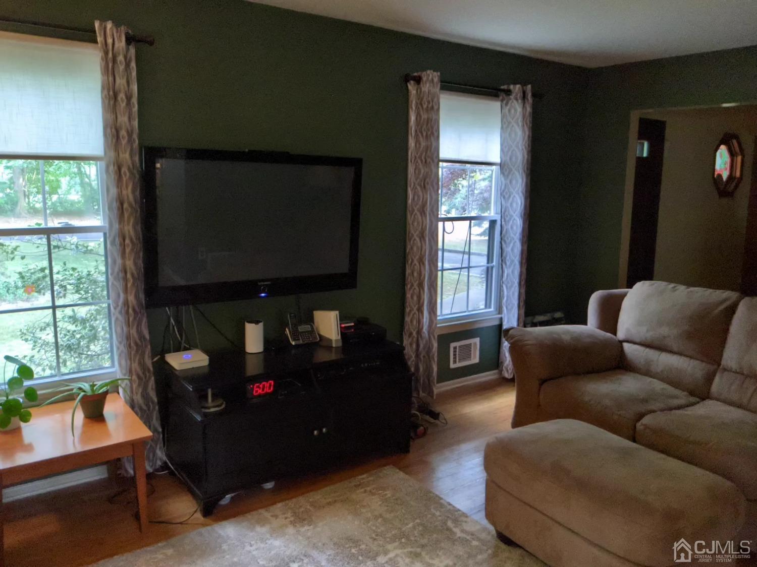 2 Ellen Circle Old Bridge, NJ 08857 - Photo 3 of 9 a living room with furniture a flat screen tv and a window