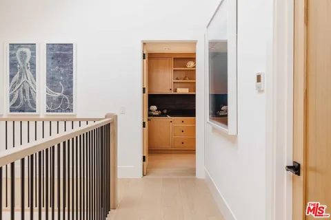a spacious bedroom with a bed couch and a window