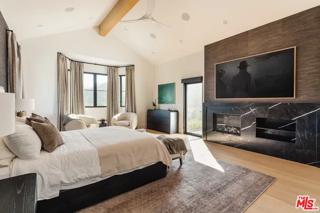 a spacious bathroom with a double vanity sink a mirror and a bathtub