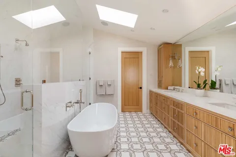 a white bath tub sitting in a bathroom