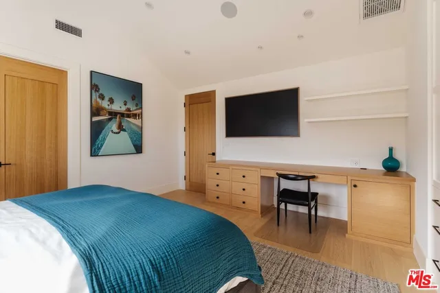 a view of a bathroom with a shower and a sink