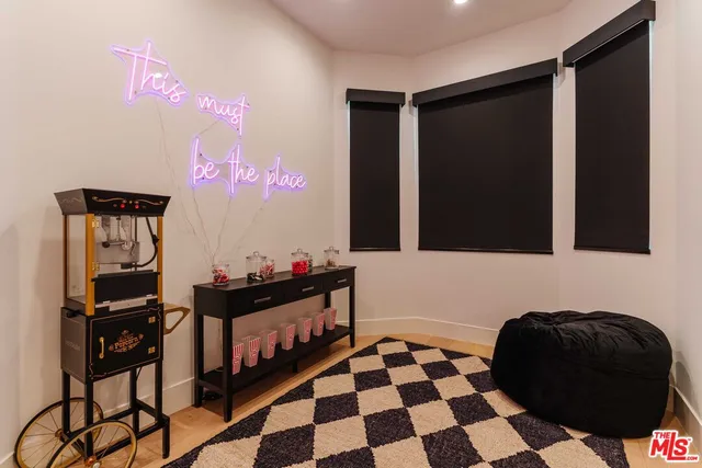 a bathroom with a sink mirror and a window