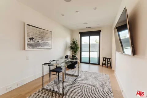 a bathroom with a sink vanity and a mirror
