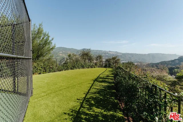 an aerial view of houses covered in trees