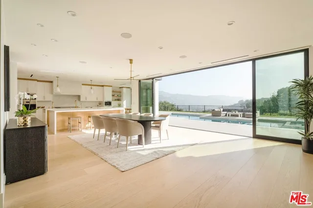 a view of a living room and a floor to ceiling window
