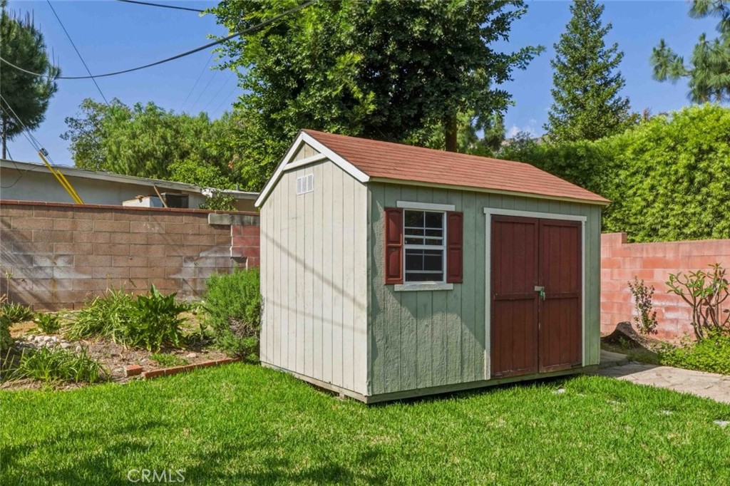 301 West Ashby Street Azusa, CA 91702 - Photo 34 of 75 a view of a small house with backyard
