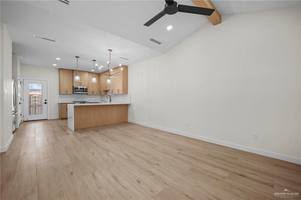 2709 Mockingbird Road, Unit 4 Weslaco, TX 78596 - Photo 4 of 20 a view of kitchen with wooden floor and window