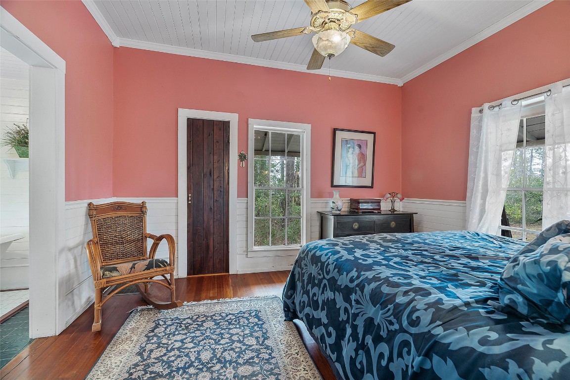 65094 Logan Road Yulee, FL 32097 - Photo 11 of 38 a bedroom with a bed and wooden floor