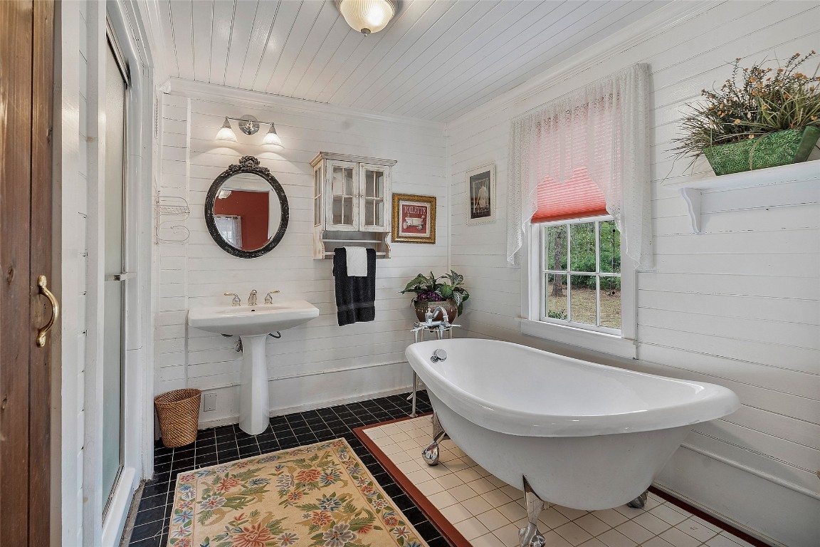 65094 Logan Road Yulee, FL 32097 - Photo 12 of 38 a bathroom with a toilet a sink and a mirror