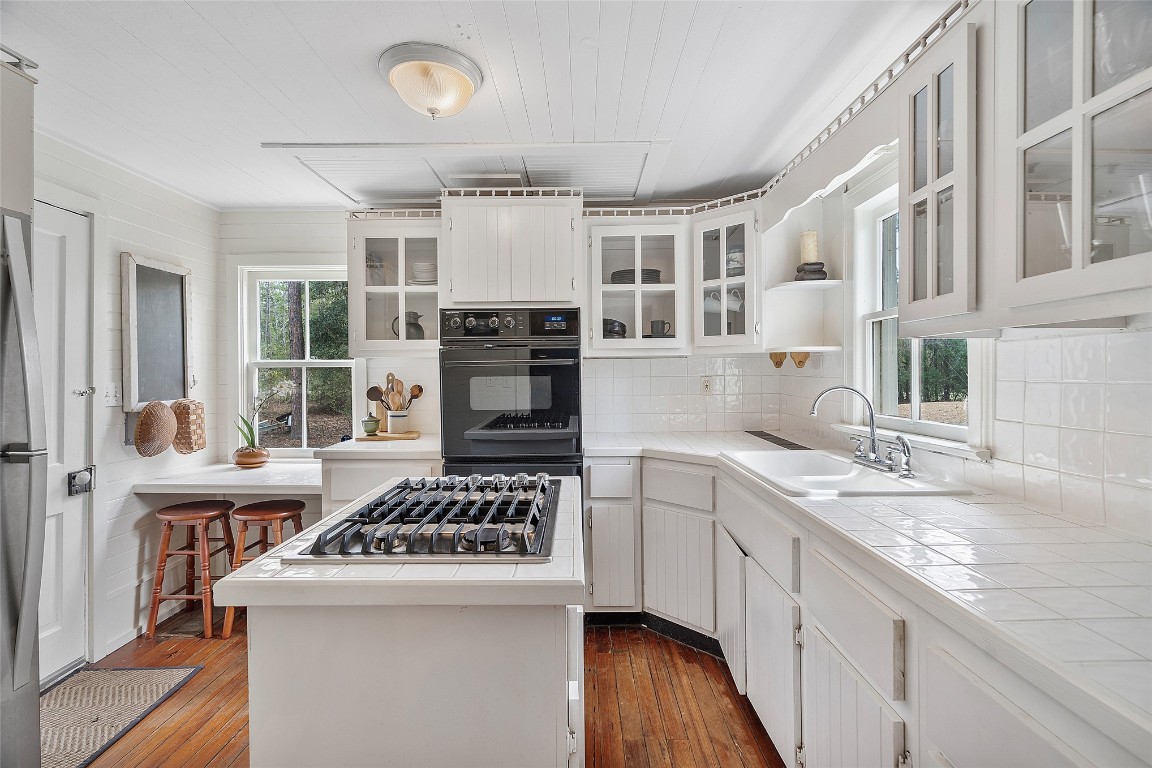 65094 Logan Road Yulee, FL 32097 - Photo 20 of 38 a kitchen with a stove and a sink