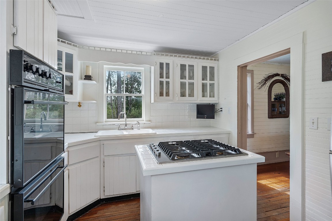 65094 Logan Road Yulee, FL 32097 - Photo 21 of 38 a kitchen with stainless steel appliances granite countertop a stove and a refrigerator