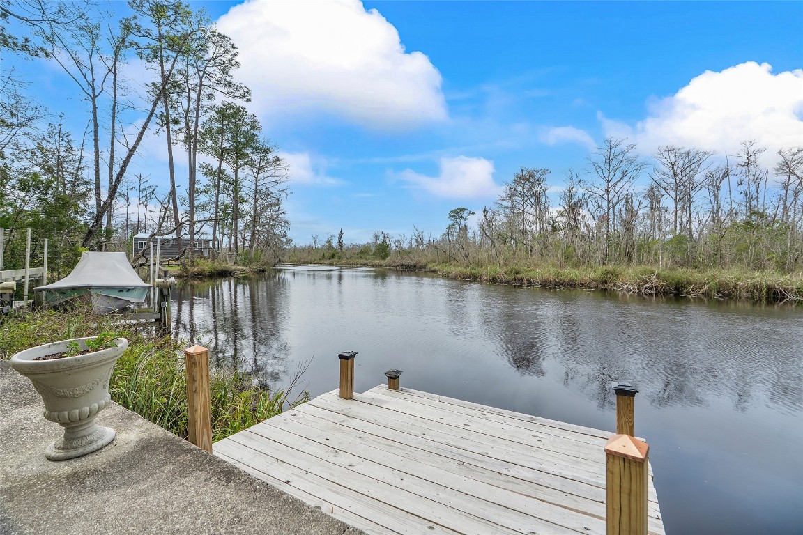 65094 Logan Road Yulee, FL 32097 - Photo 28 of 38 a view of a lake with houses