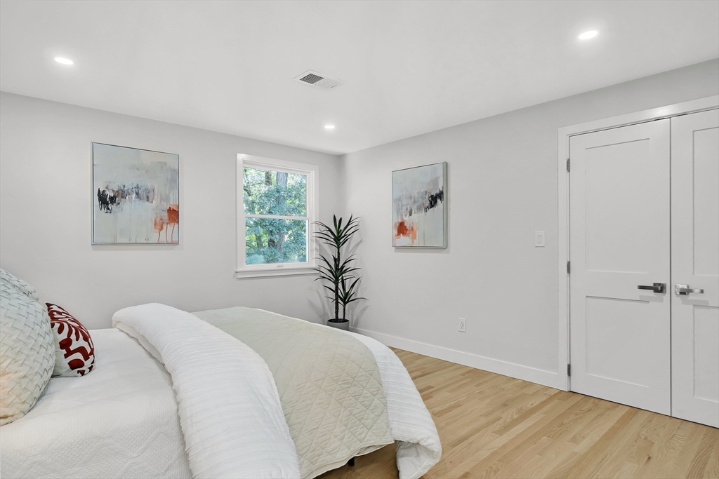 95 Country Club Road Dedham, MA 02026 - Photo 17 of 21 a bedroom with a bed and a window
