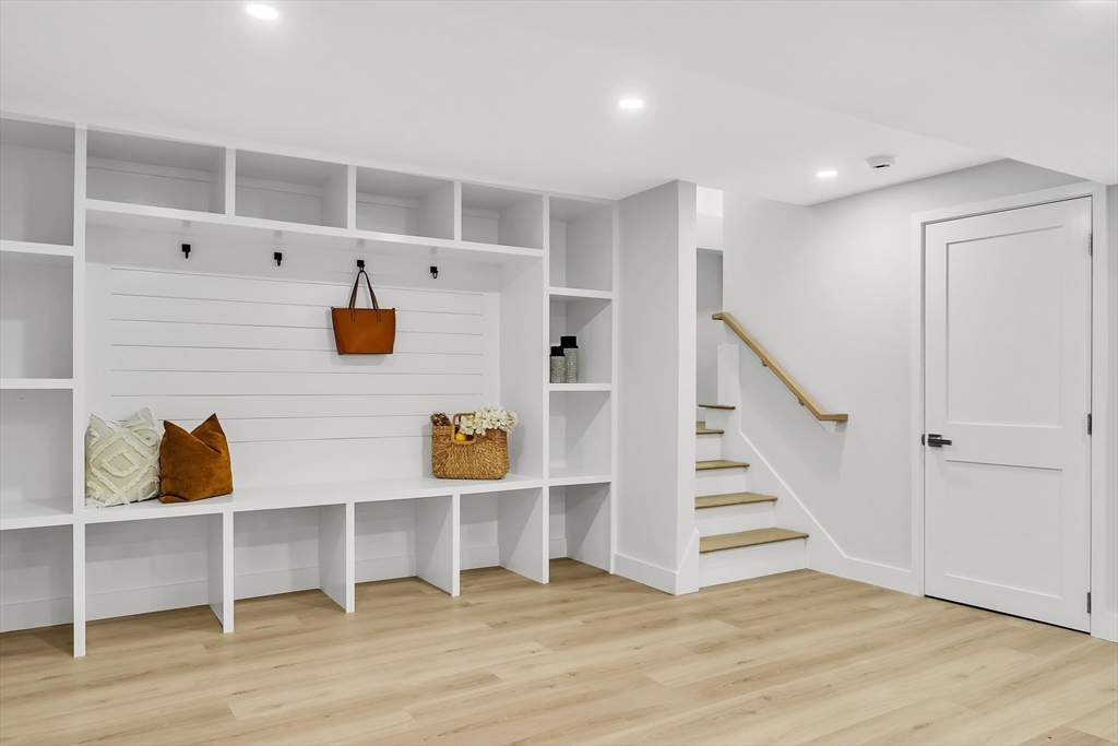 95 Country Club Road Dedham, MA 02026 - Photo 18 of 21 a view of an empty room with wooden floor and entryway
