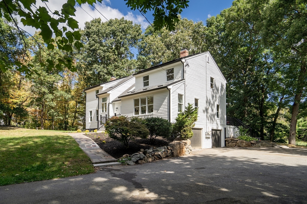 95 Country Club Road Dedham, MA 02026 - Photo 21 of 21 a view of a house with backyard sitting area and garden