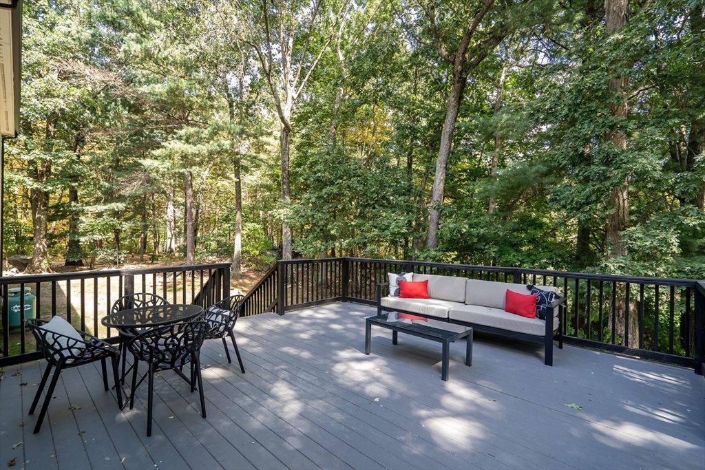 95 Country Club Road Dedham, MA 02026 - Photo 4 of 21 a backyard of a house with wooden floor and outdoor seating