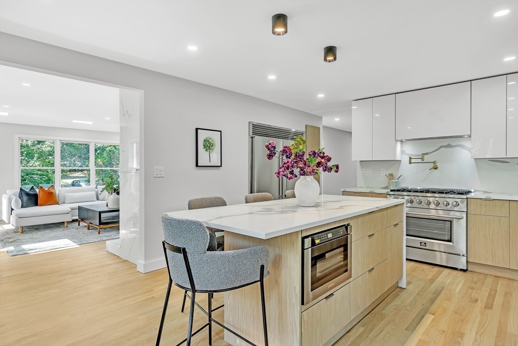 95 Country Club Road Dedham, MA 02026 - Photo 5 of 21 a kitchen that has a lot of cabinets in it and wooden floors