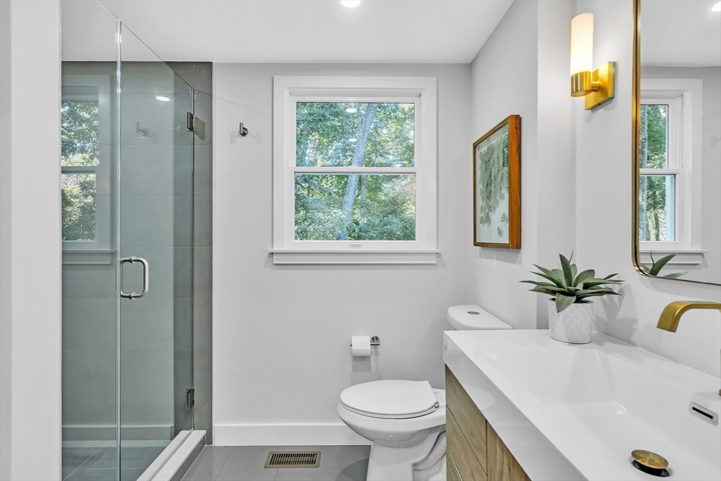 95 Country Club Road Dedham, MA 02026 - Photo 8 of 21 a bathroom with a sink and a toilet