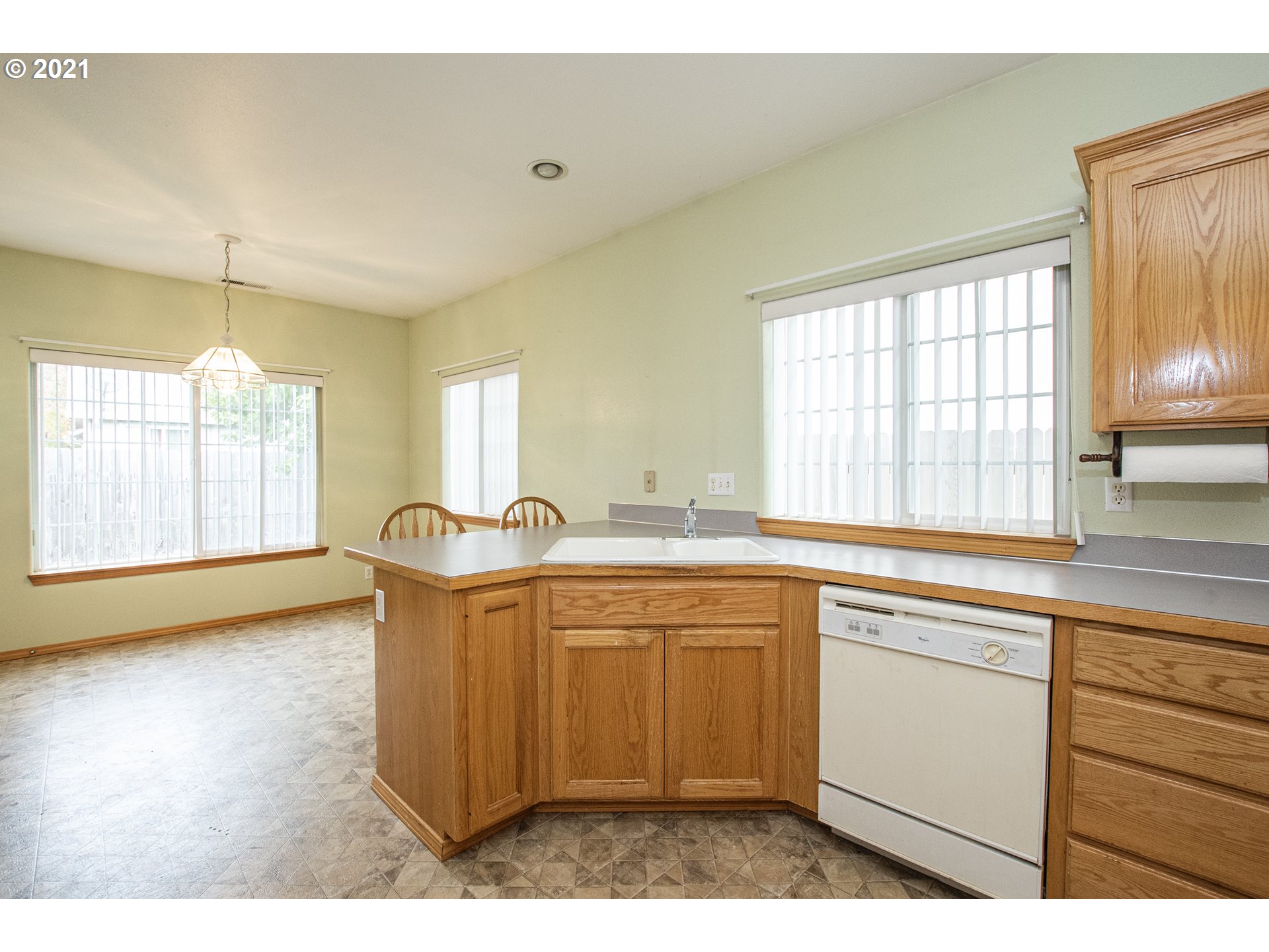 4142 South E Street Springfield, OR 97478 - Photo 11 of 26 a kitchen with stainless steel appliances granite countertop a sink stove and cabinets