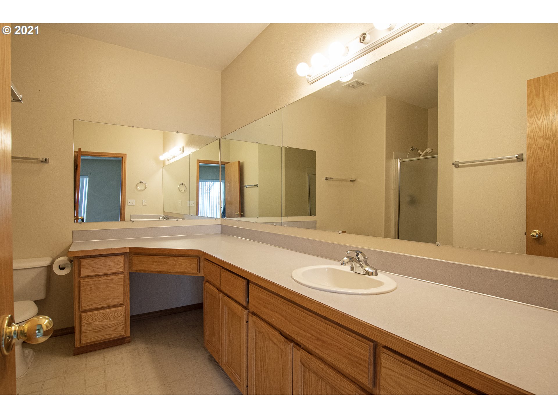 4142 South E Street Springfield, OR 97478 - Photo 16 of 26 a bathroom with a sink double vanity and a mirror