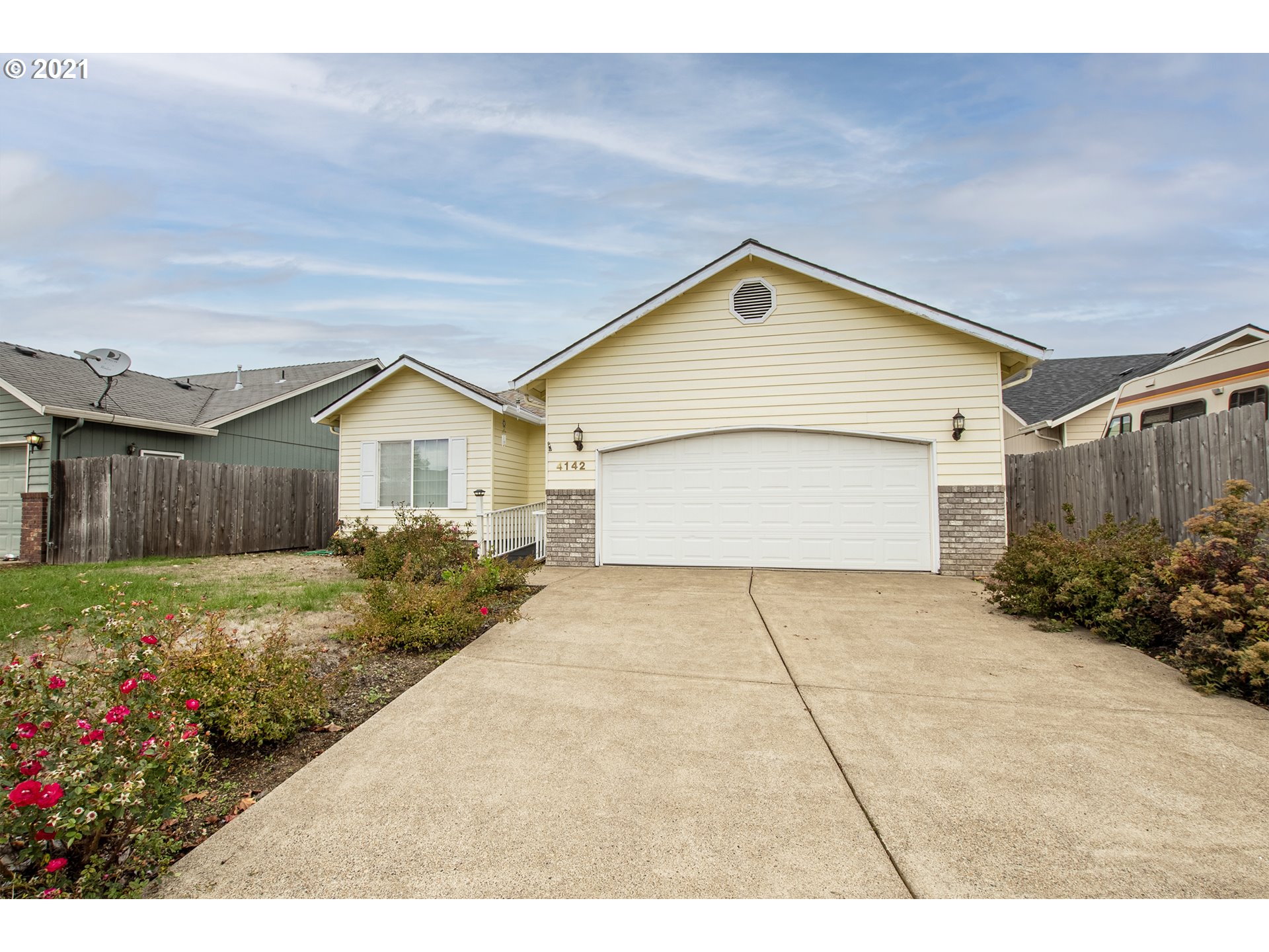 4142 South E Street Springfield, OR 97478 - Photo 3 of 26 a view of backyard of house along with wooden fence