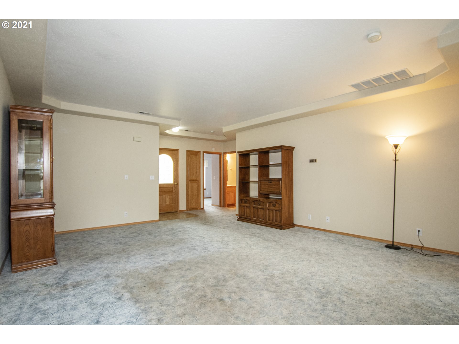 4142 South E Street Springfield, OR 97478 - Photo 6 of 26 a view of an empty room with window and chandelier