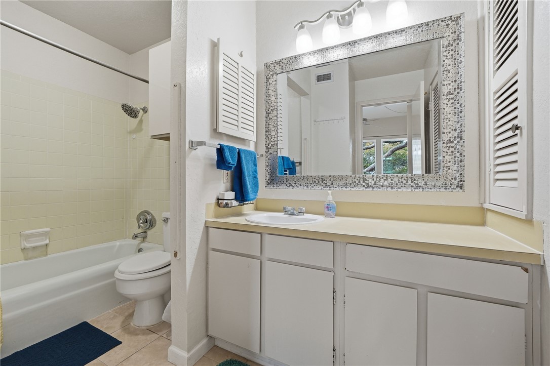 2003 North Fulton Beach Road, Unit 34 34 Rockport, TX 78382 - Photo 20 of 38 a bathroom with a sink and a mirror