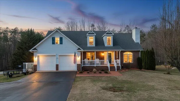 a view of a house with basket ball court and a view of house