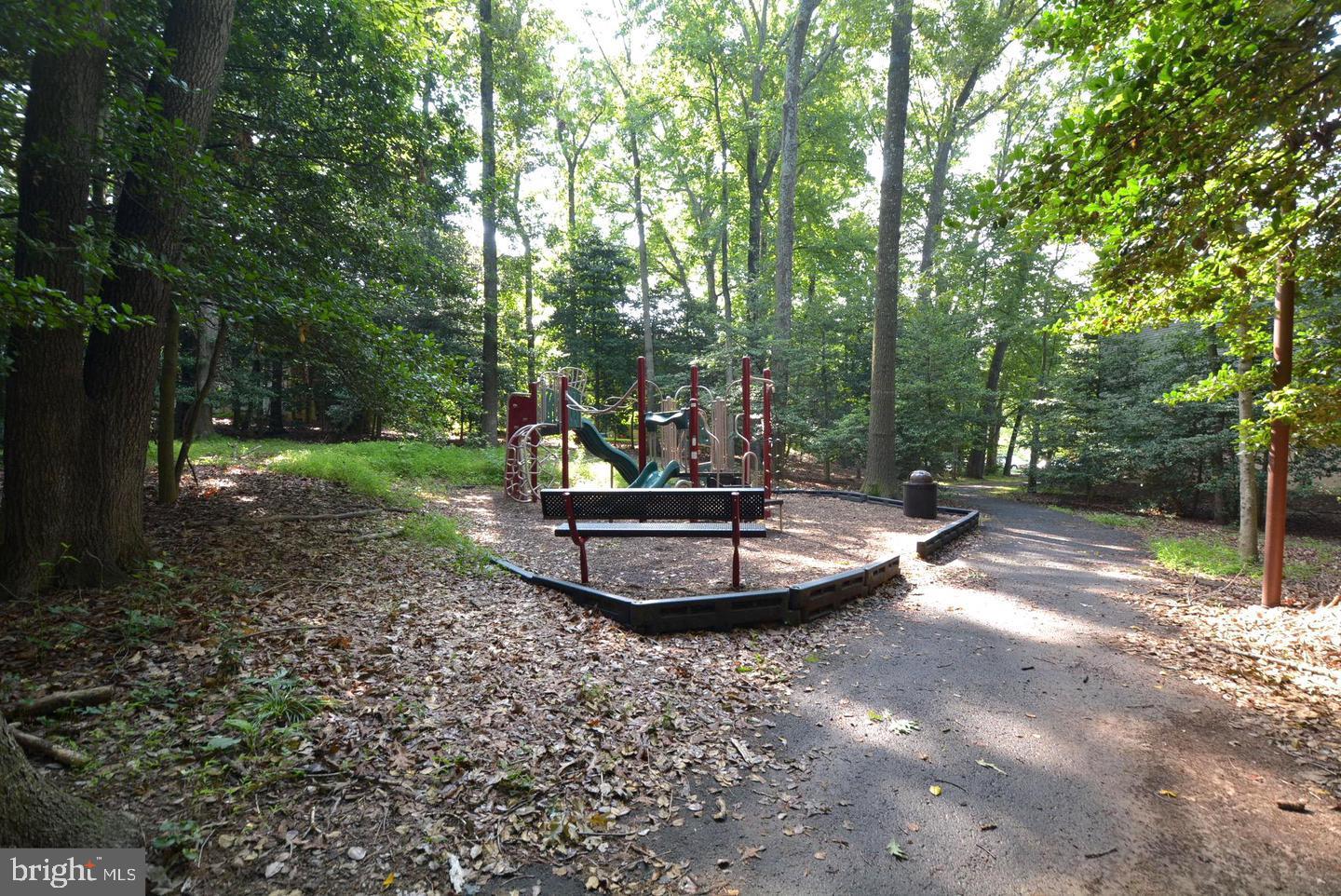 11643 Stoneview Square, Unit 2B Reston, VA 20191 - Photo 7 of 12 Secluded playground in lush greenery.