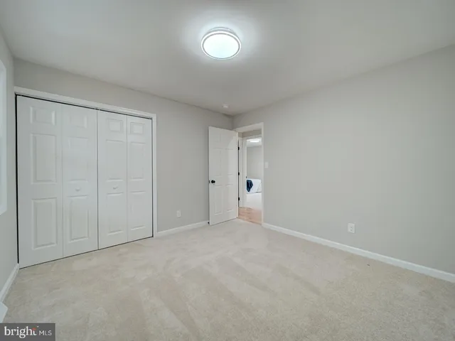 a view of an empty room and a window